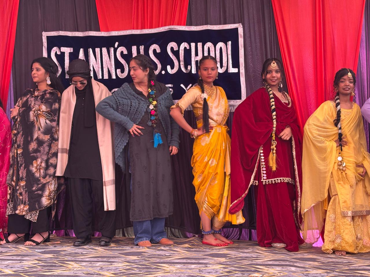Students dressed for a cultural ensemble at Saint Ann's School