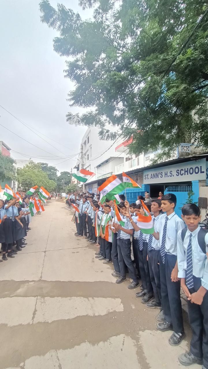 Students participating in a patriotic school rally outside Saint Ann's School